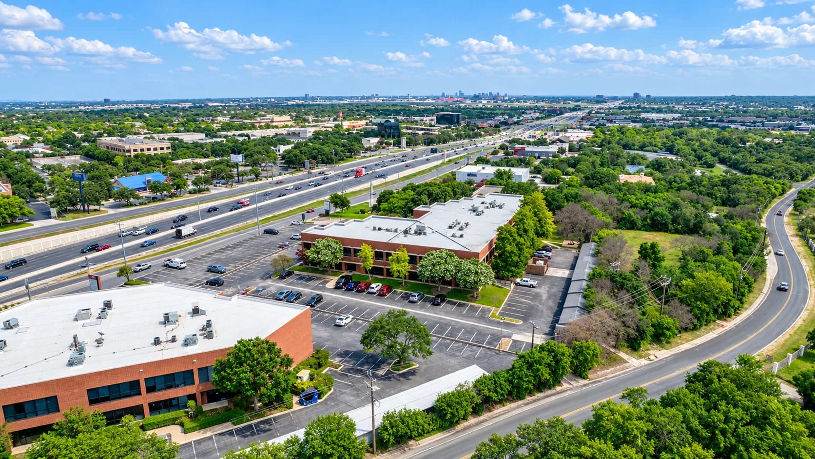 Aerial view of Tru Medical Office Park on San Pedro Avenue with the San Antonio skyline beyond